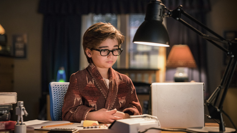 Young Leonard at his desk