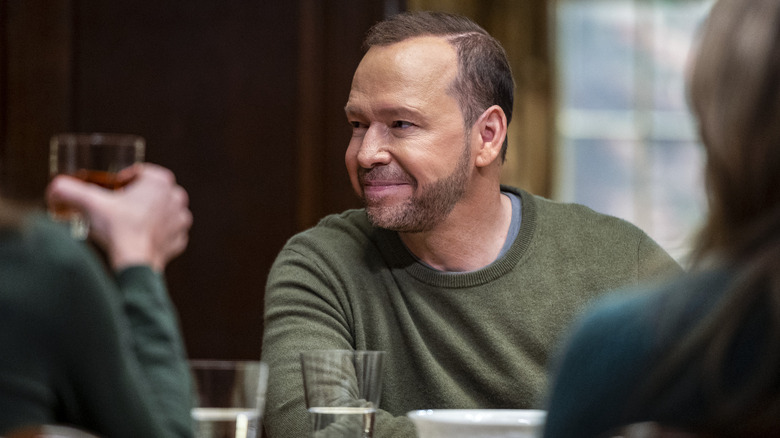 Danny smiling at family dinner