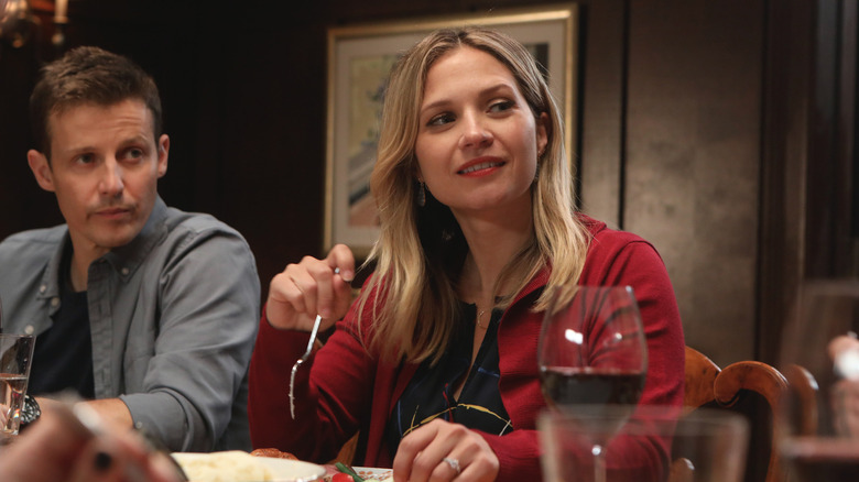 Jamie and Eddie sitting at family dinner