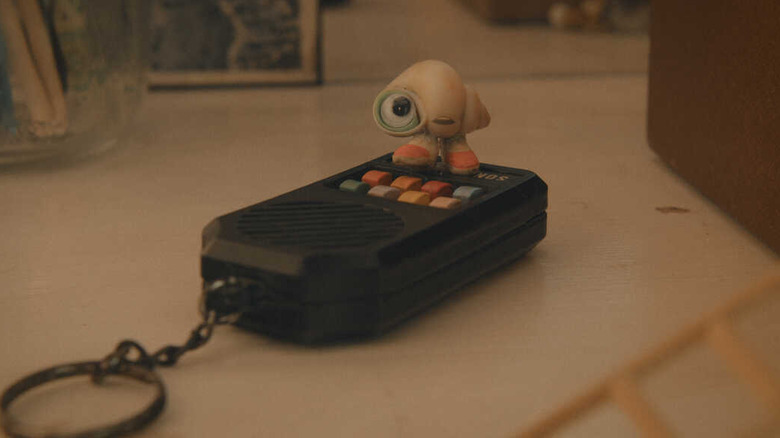 Marcel the Shell standing on remote