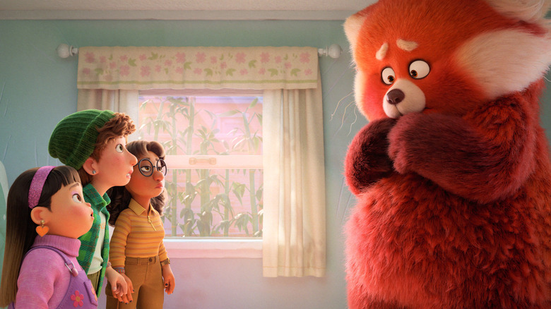 Children looking at red panda