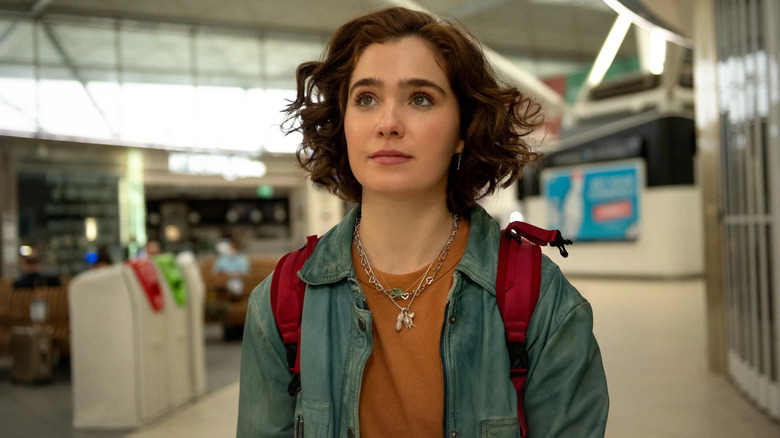 Hadley smiling in an airport terminal