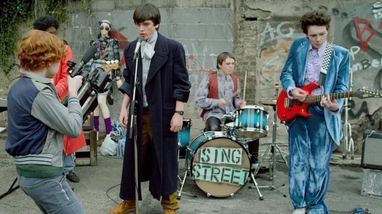 Conor's band performing to a camera in a homemade music video