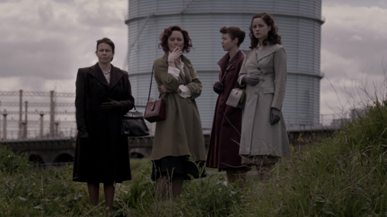 Susan, Millie, Lucy, and Jean stand outside