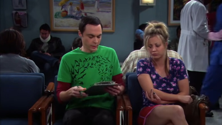 Sheldon and Penny filling out forms together