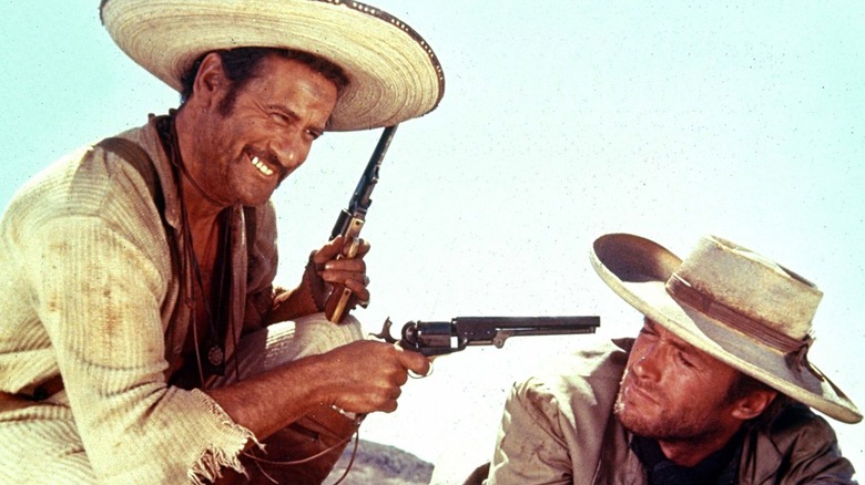 Tuco pointing gun at Blondie