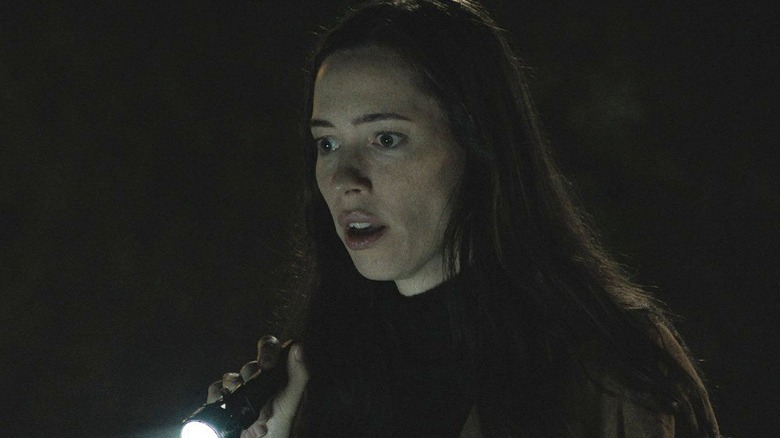 Rebecca Hall holding flashlight