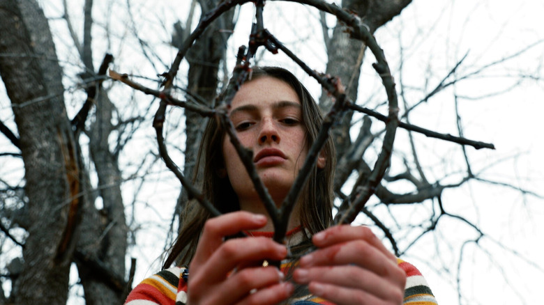 Izzy holding a sigil