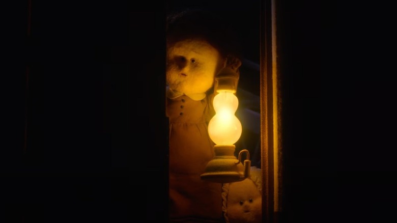 Mabel holding a lantern