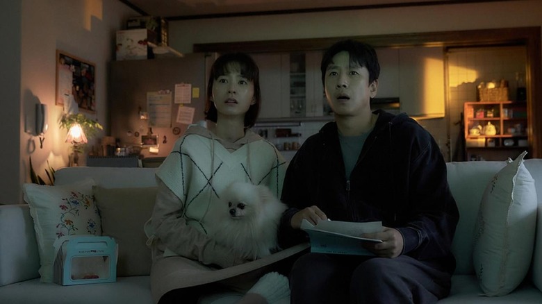 Hyun-su, Soo-jin, and their dog sitting