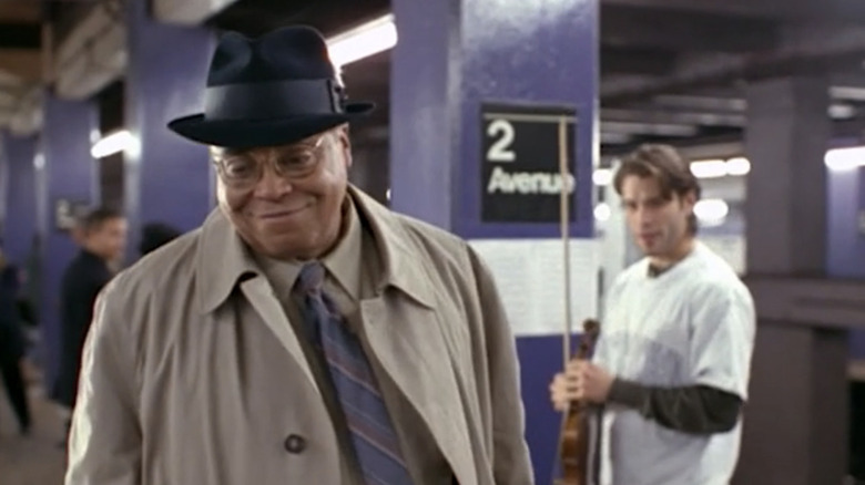 James Earl Jones smiles on a subway platform