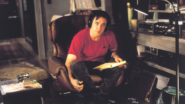 Rob listening to music in High Fidelity