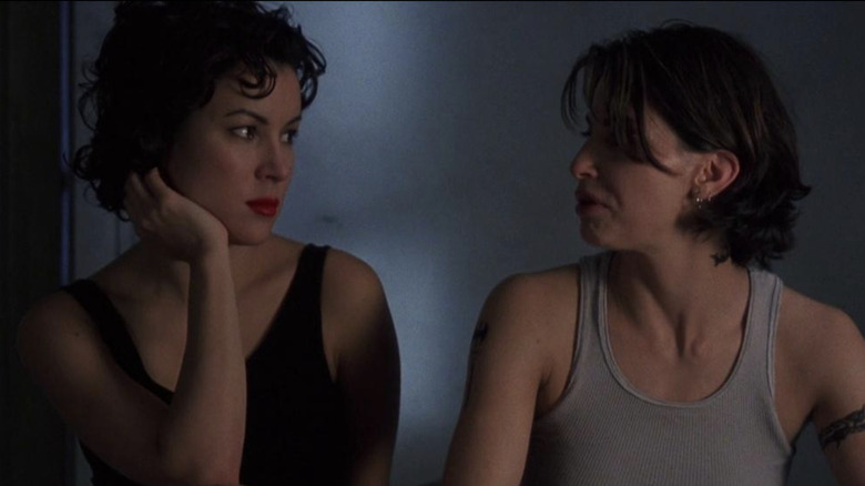 Jennifer Tilly looks at Gina Gershon in profile