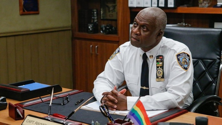 Unamused Captain Holt with Pride flag