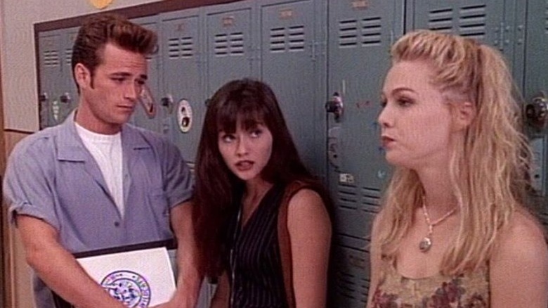 Brenda, Dylan, and Kelly standing in school