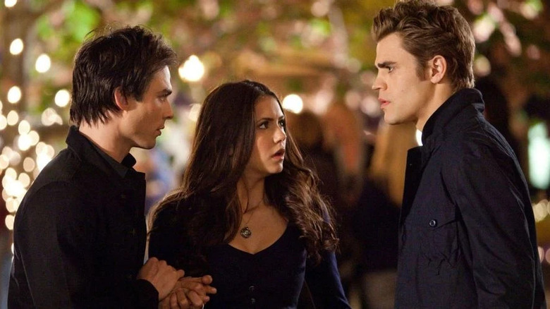 Stefan, Elena, and Damon talking on the street