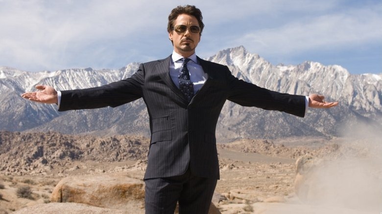 Tony Stark is spreading his arms.