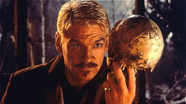 Kenneth Branagh holding a skull