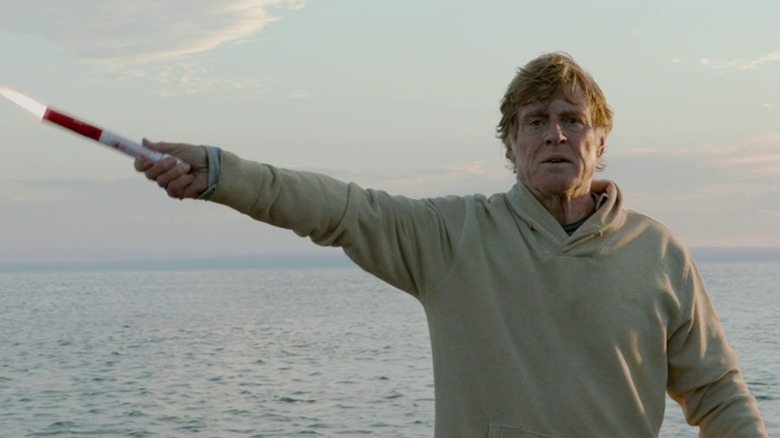 Robert Redford holding flare