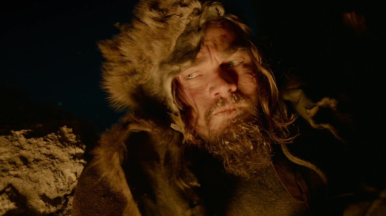 Hugh Glass illuminated by campfire