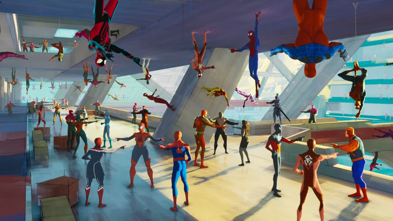 Spider-Man Across the Spider-Verse's Spider-Men pointing at each other in room