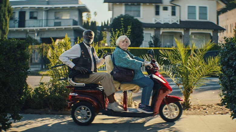 Thelma and Ben riding scooter