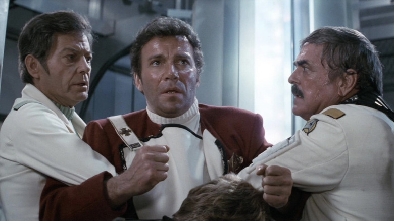 Bones and Scotty hold Kirk back in Star Trek II: The Wrath of Khan