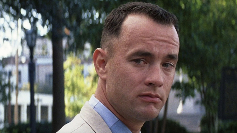 Forrest looks beside himself on a park bench in Forrest Gump (1994)