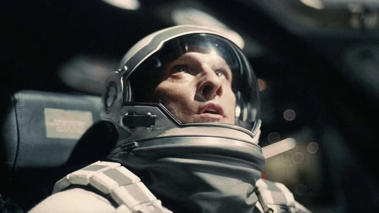 Cooper looks out at the stars while in space in Interstellar (2014)