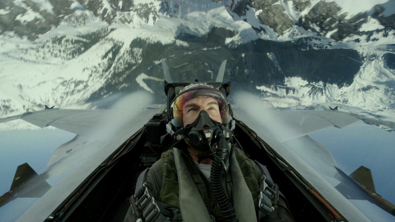 Pete "Maverick" Mitchell flies upside down in the mountains in Top Gun: Maverick (2022)