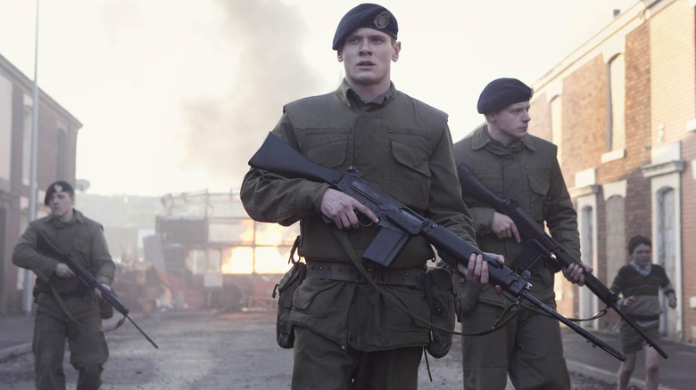 Gary standing with other British soldiers