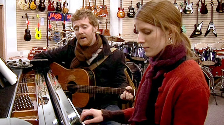 The main characters playing music together