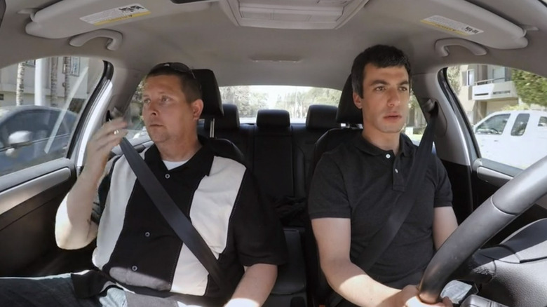 Nathan Fielder and man in car