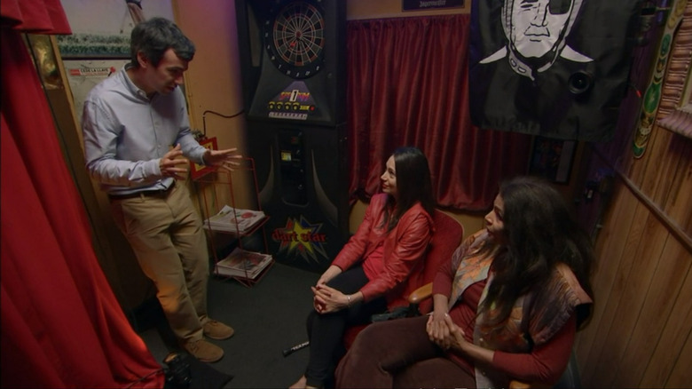 Nathan Fielder talking to two women