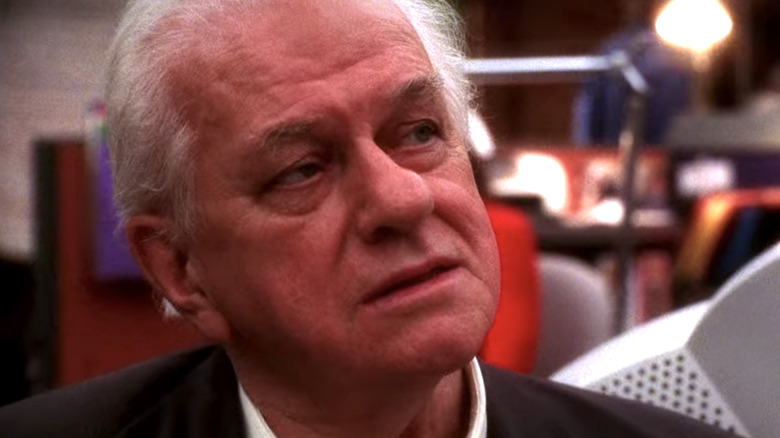 Charles Durning serious as Ernie Yost