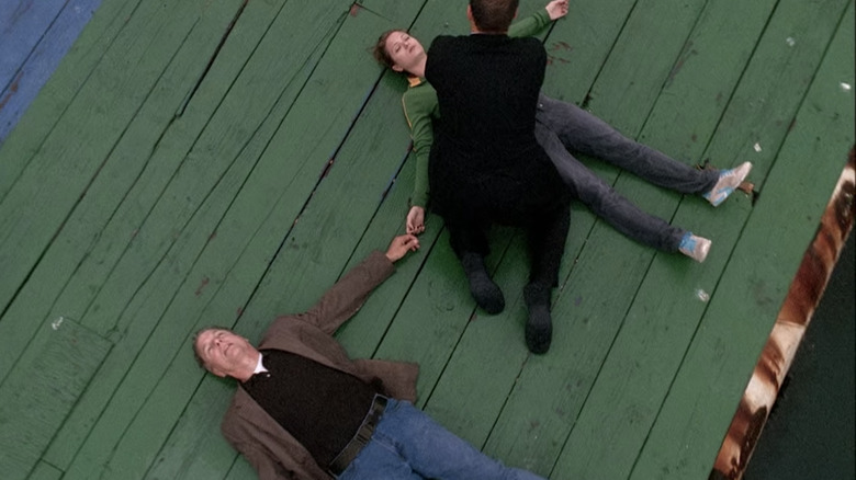 Gibbs and Maddie lying unconscious on a pier 