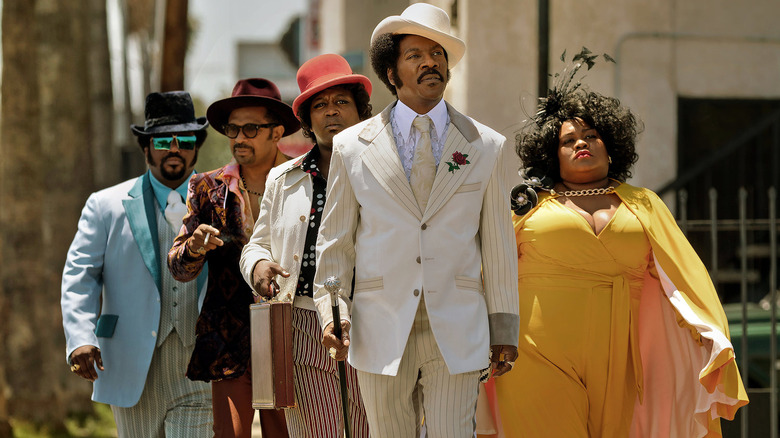 Rudy Ray Moore and crew walking