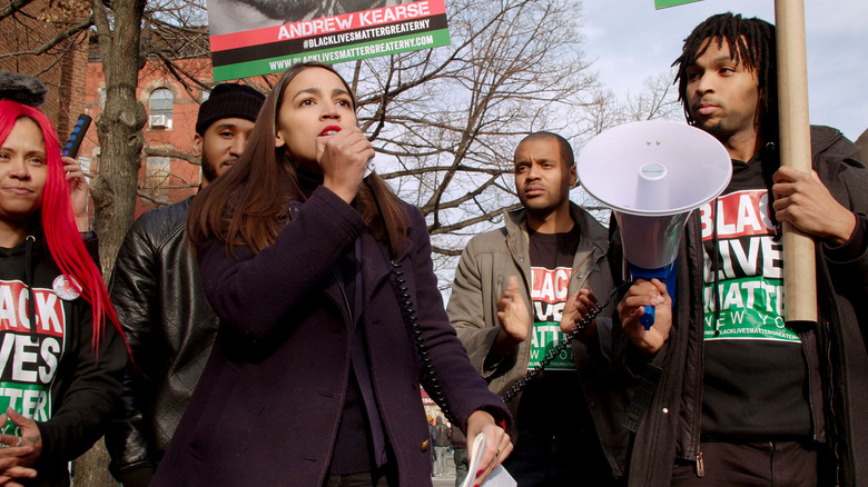 Alexandria Ocasio-Cortez on microphone