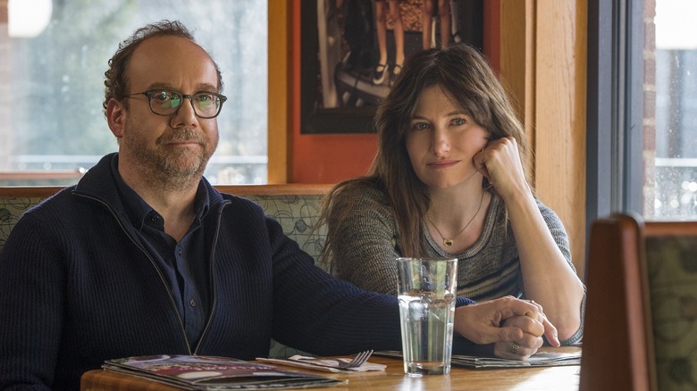 Kathryn Hahn and Paul Giamatti sitting at table