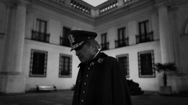 Pinochet looking down solemnly