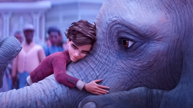 Peter hugging an elephant