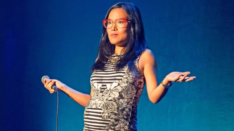 A visibly pregnant Ali Wong performing her comedy special Baby Cobra