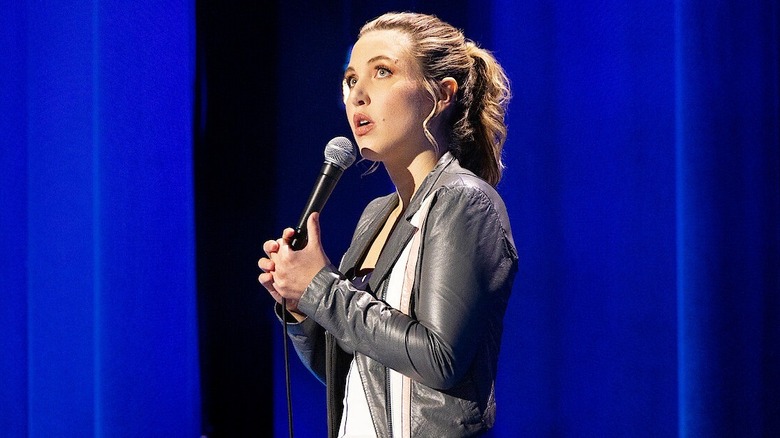 Taylor Tomlinson performs a stand-up special on stage