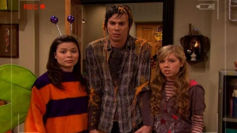 Carly, Spencer, and Sam standing in doorway