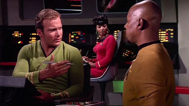 Sisko approaches Kirk on the Enterprise