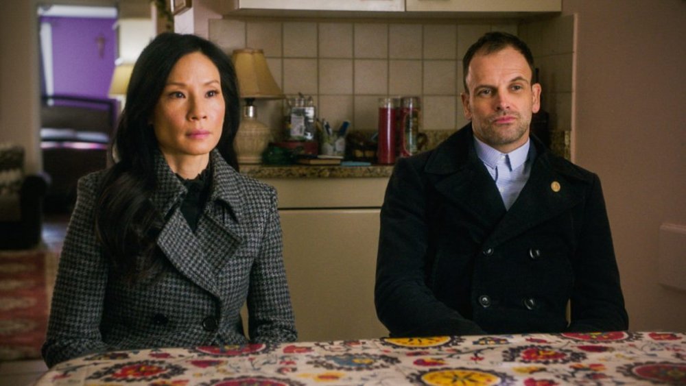 Jonny Lee Miller as Sherlock Holmes and Lucy Liu as Dr. Joan Watson in Elemetary