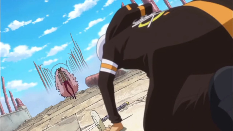 Doflamingo walks toward Law