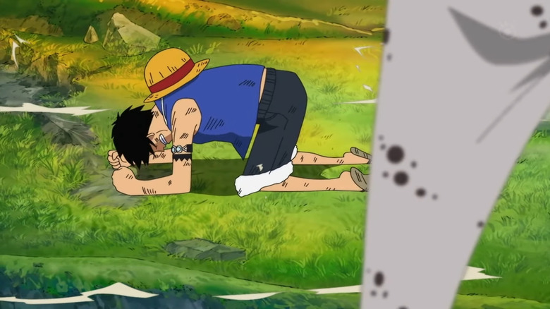 Luffy kneeling on the ground