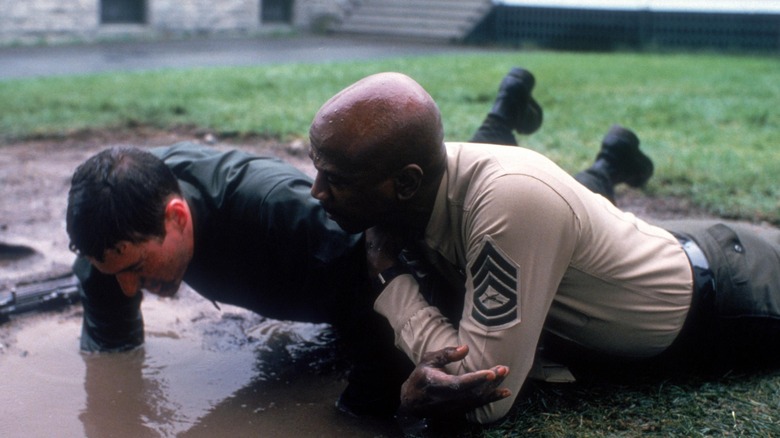 Zack doing press ups in the mud 