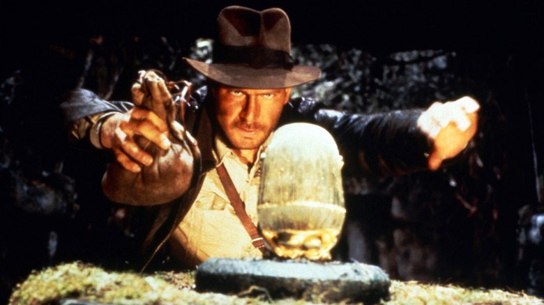 Indiana Jones about to steal some treasure 